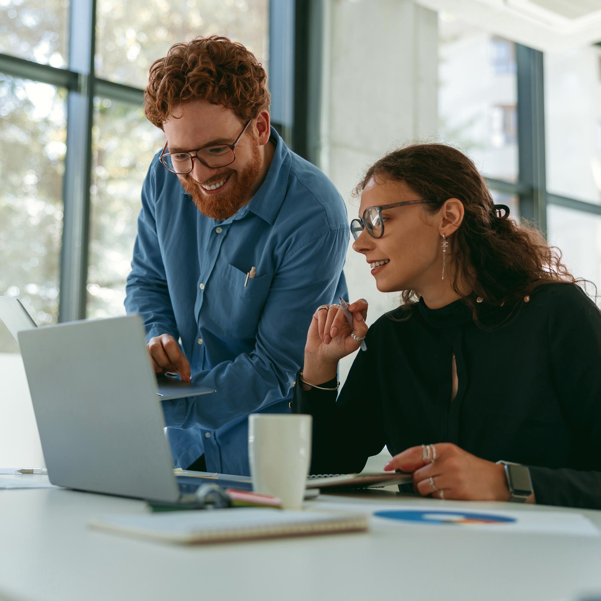 Employees engaged in a collaborative work session